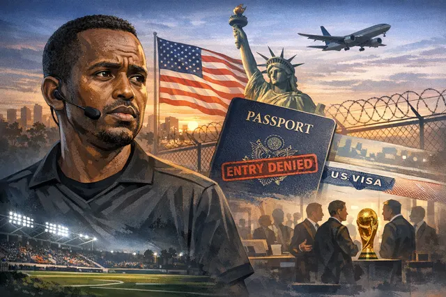 Somali referee Omar Abdulkadir Artan on a football pitch, blurred crowd behind him, holding a whistle, after being denied U.S. entry for the 2026 FIFA World Cup and appointed to UE